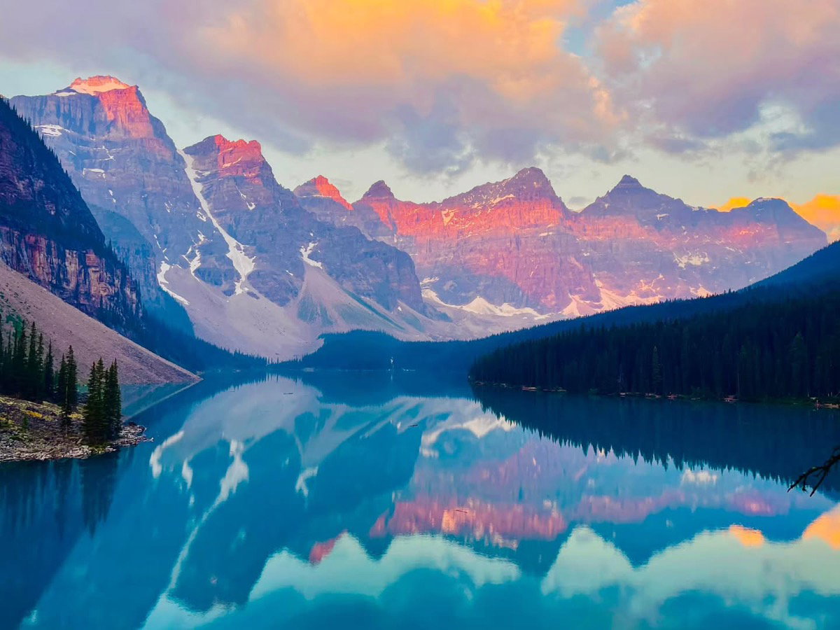 Sunrise light on the Valley of the Ten Peaks reflected in Moraine Lake