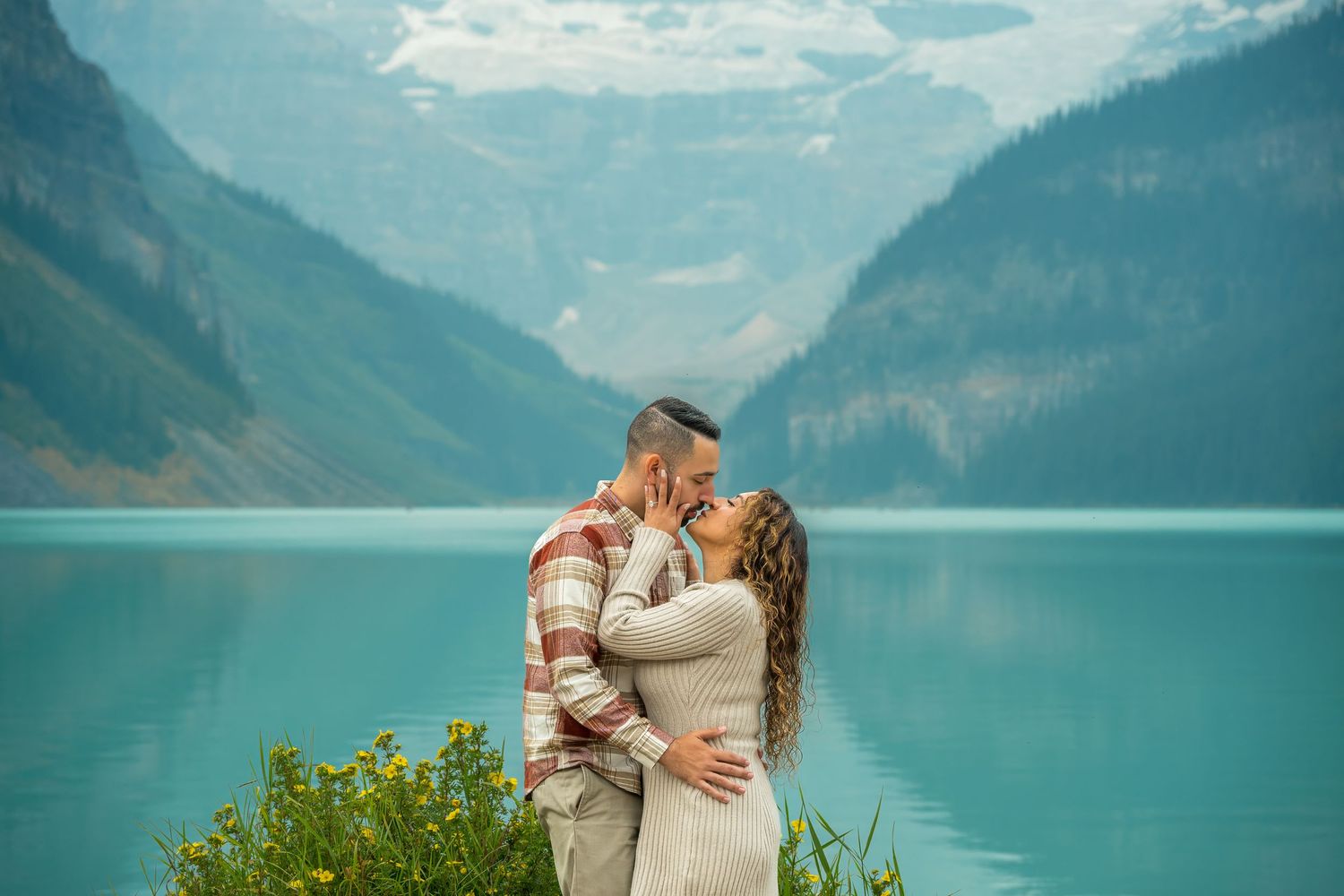 A couple kissing at Lake Louise in Banff National Park.