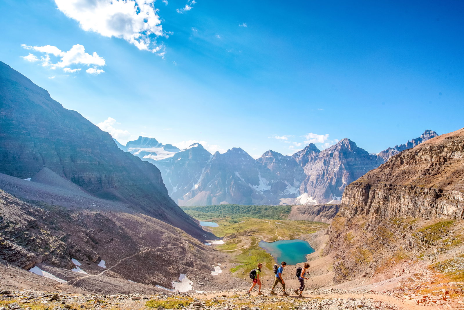 A group of hikers tackling one of the many trails at Moraine Lake in Banff National Park.