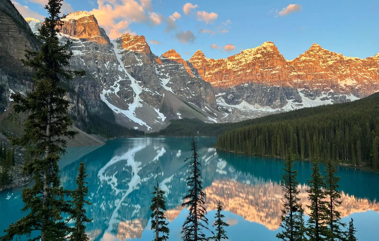 Moraine Lake sunrise with mountains in the background