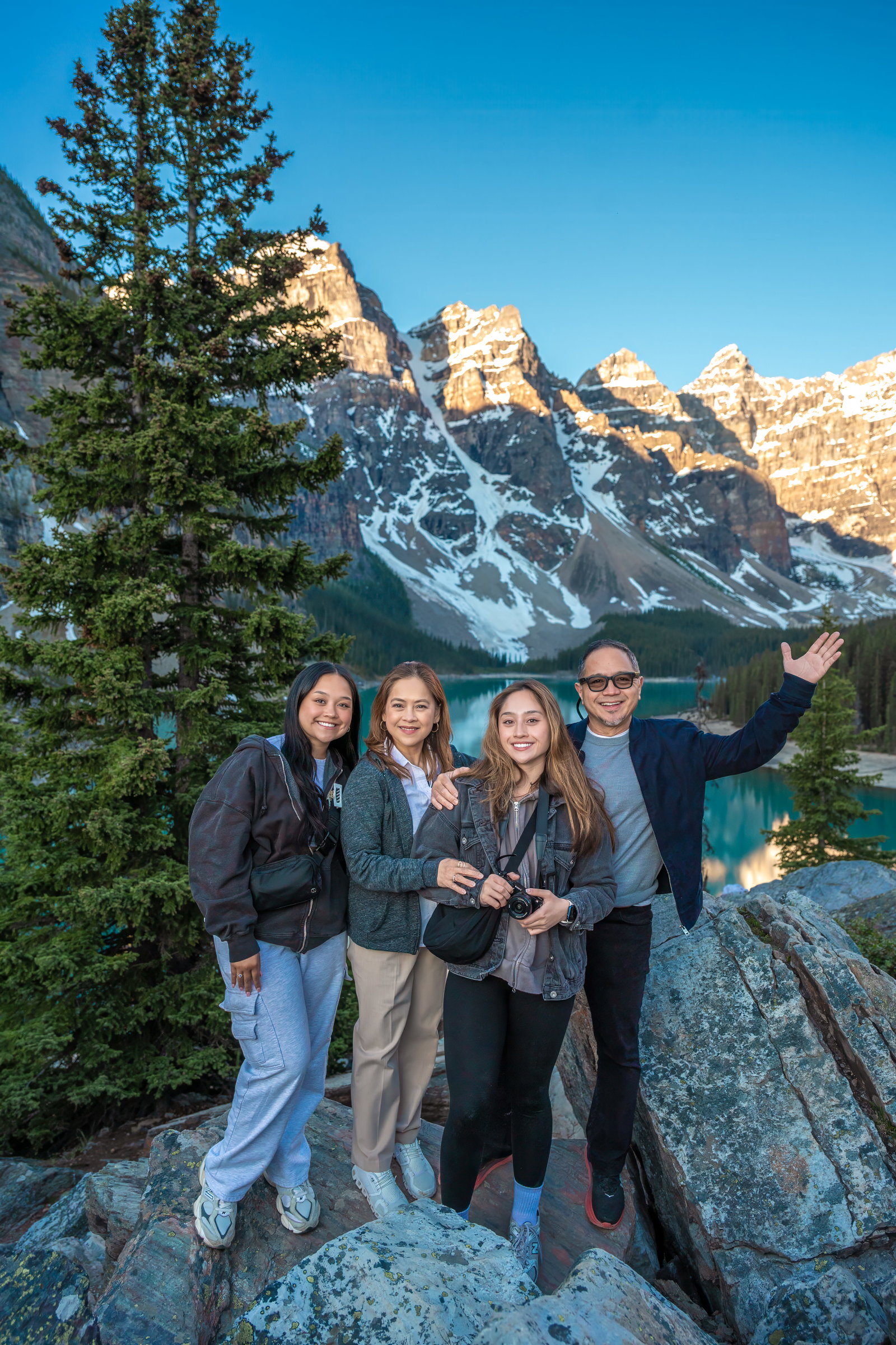 A family enjoying the view of Moraine Lake in Banff National Park.