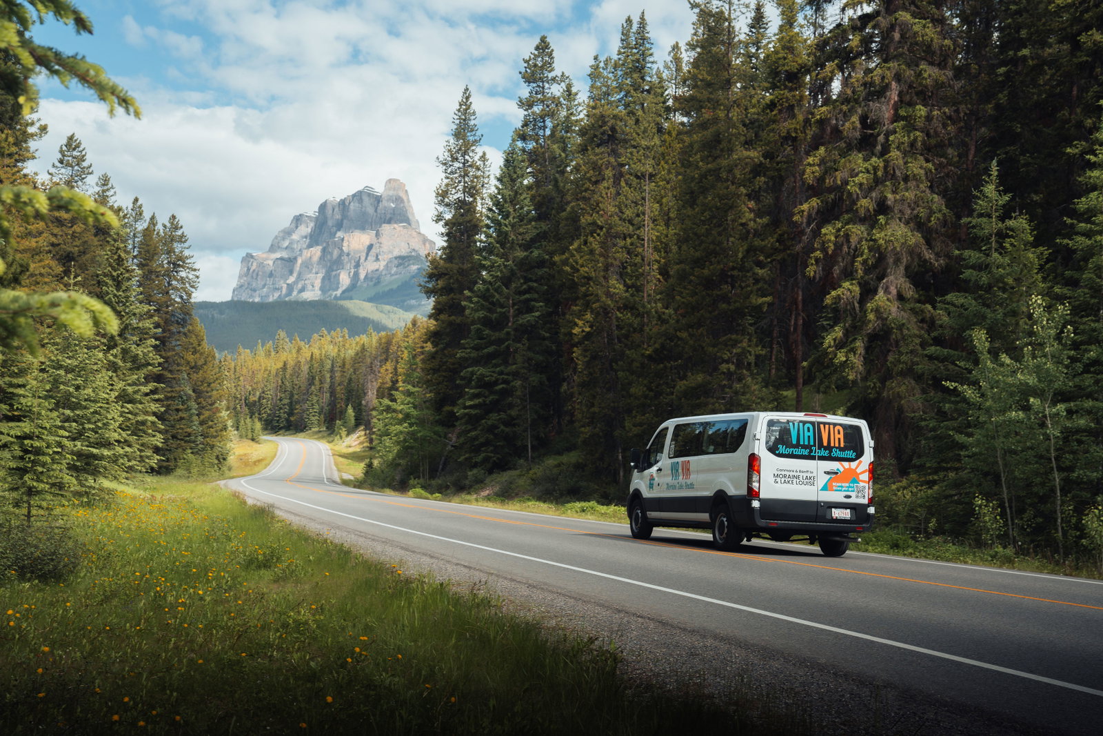 Via Via shuttle in front of mountain landscape